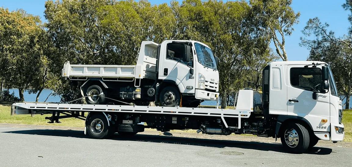 Gold Coast Towing boat and vehicle transport on a tilt tray truck